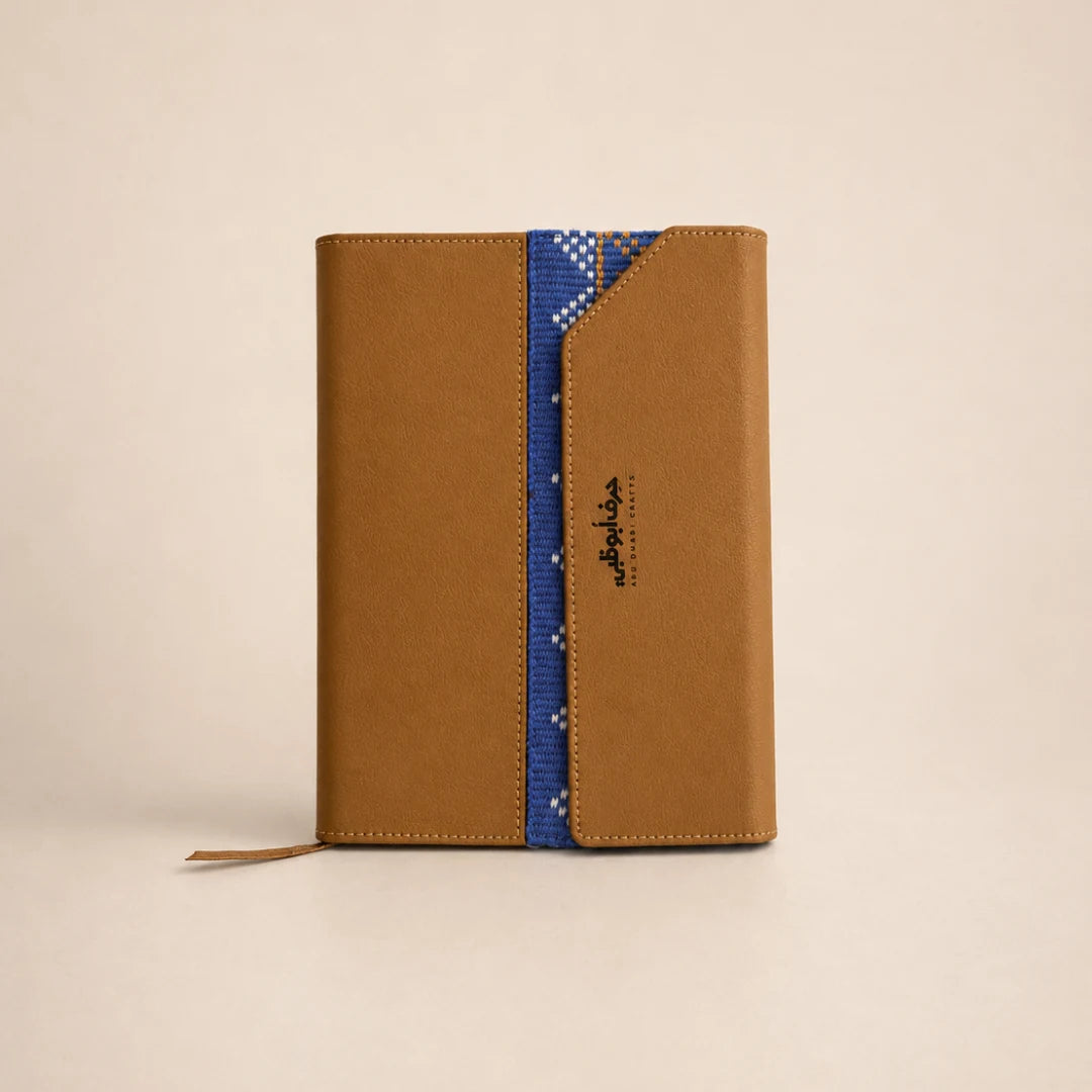 Tan leather journal with bespoke blue textile detailing
